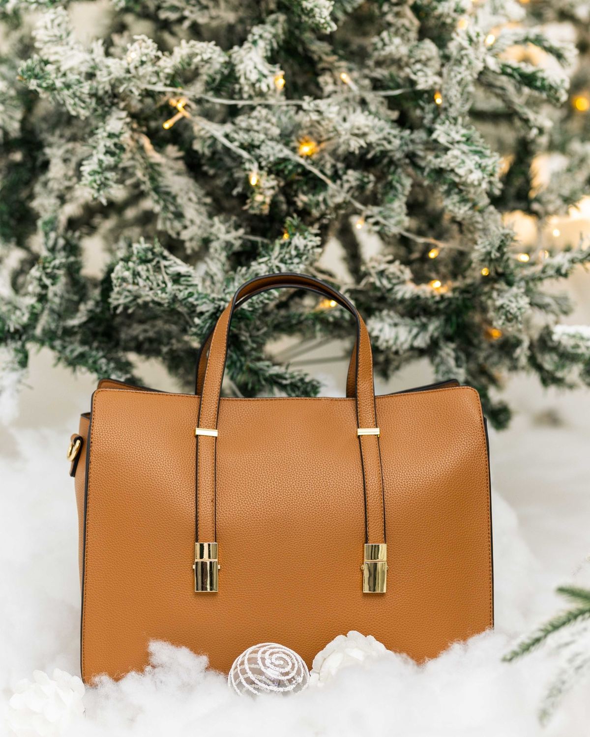 The Sybil, a structured tan tote bag by The Bag Depot, styled for the office.